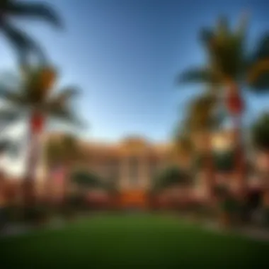 Luxury Casino Resort A scenic outdoor view of a luxury casino resort surrounded by palm trees.